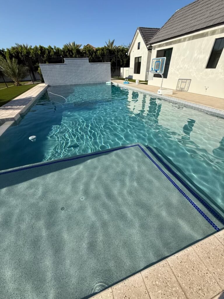 Backyard pool with dropping water level due to plumbing leak