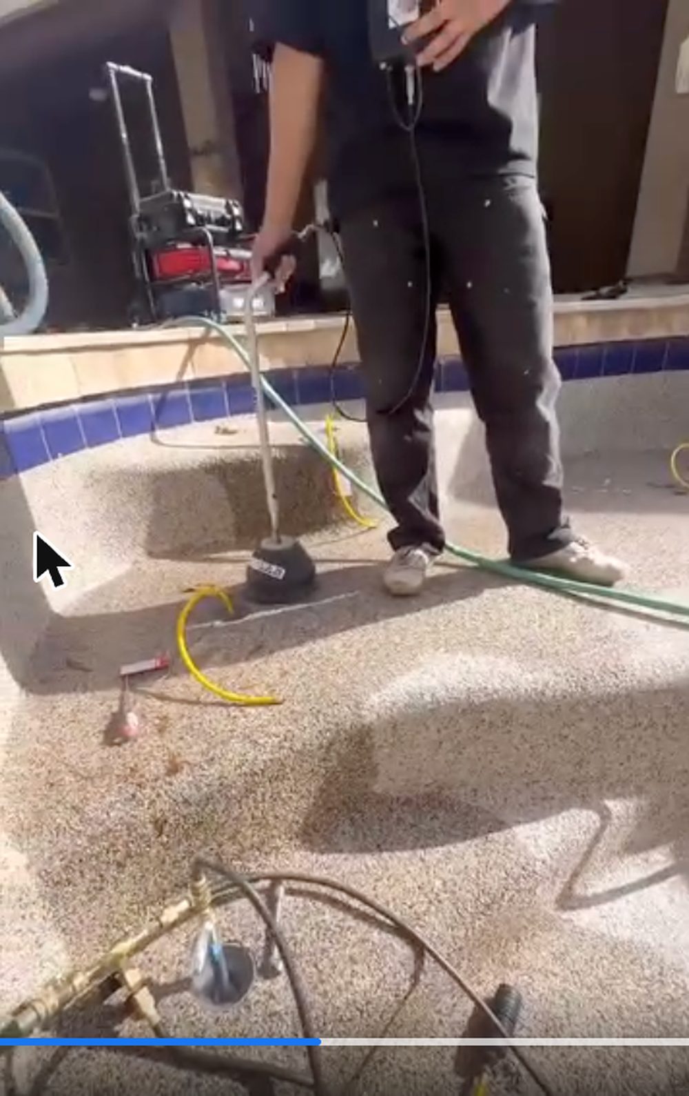 Pressure testing rig and hoses set up in a drained Chandler play pool