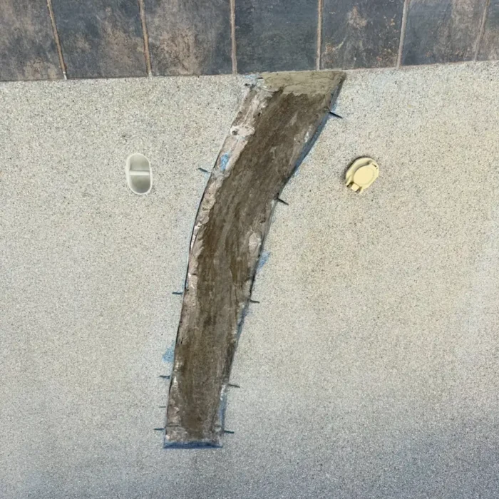 Waterproofed pool crack repair with waterline tile reset and grouted in Scottsdale