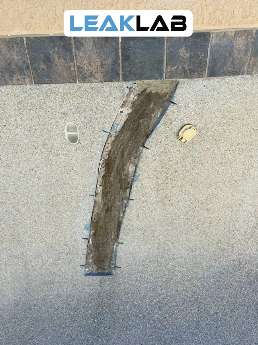 Waterproofed pool crack repair with waterline tile reset and grouted in Scottsdale